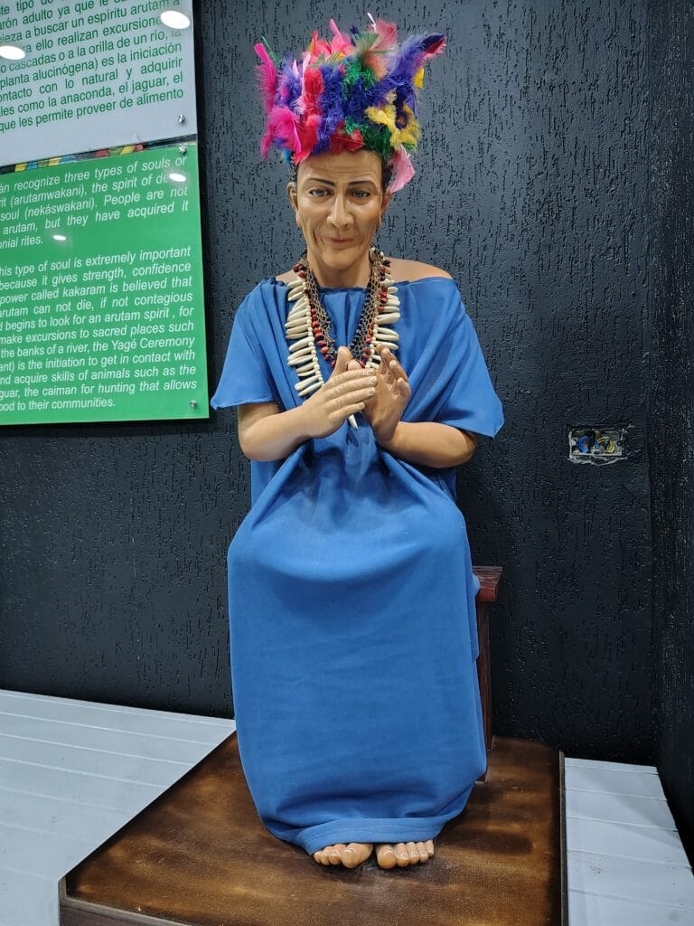 Life-sized Amazonian shaman exhibit inside the Mitad del Mundo monument museum in Ecuador.