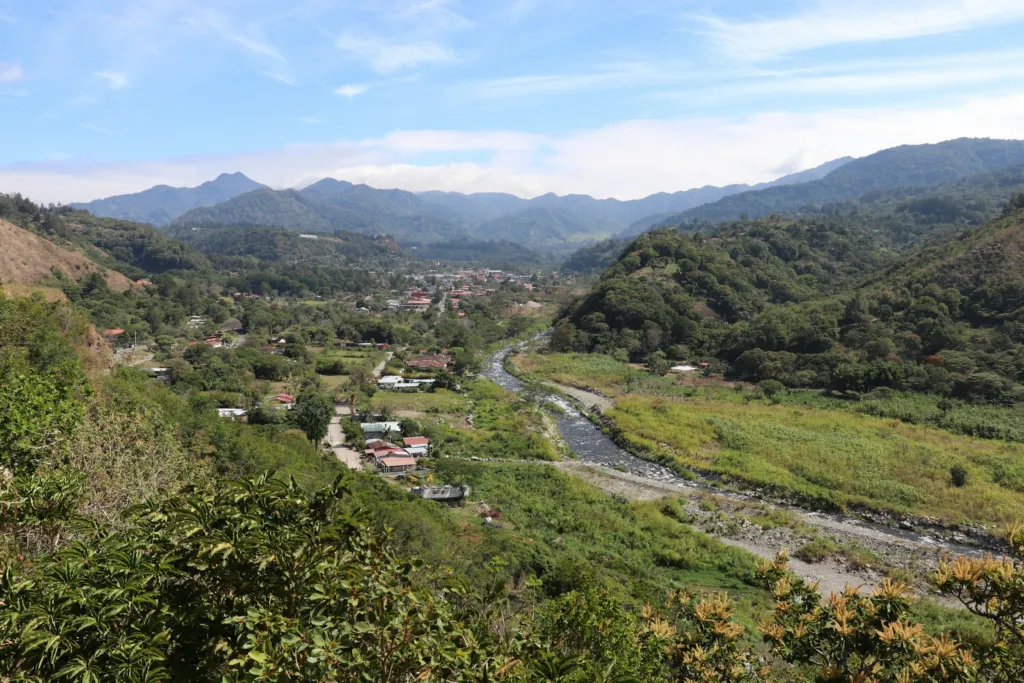 Green hills and mountains of the Chiriquí highlands around Boquete, Panama, under a blue sky