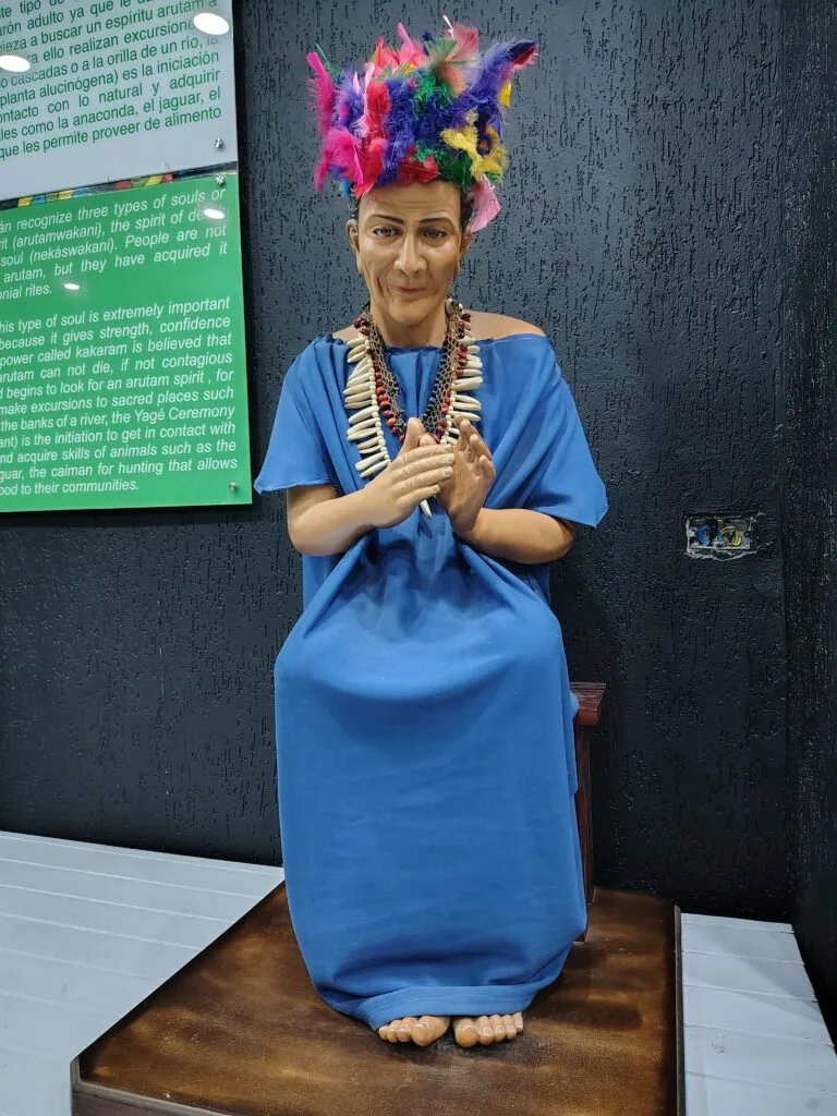 Life-sized Amazonian shaman exhibit inside the Mitad del Mundo monument museum in Ecuador.